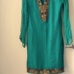 Small shirt & brown shalwar. Embroidery on neckline, chest, sleeves.